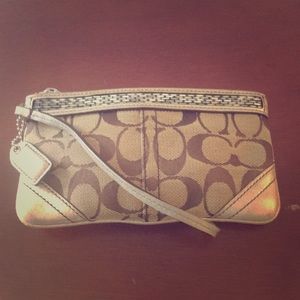 COPY - Coach signature wristlet with beaded accent.